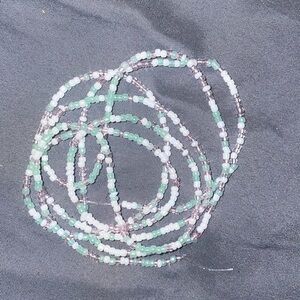 Glass seed beads . This product is a waist bead .